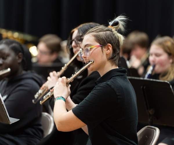 students playing in an orchestra