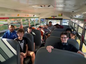 Tech volleyball players on bus