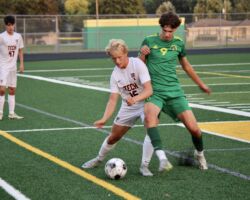 <p class="title">Title: Battle to win the ball!</p>
Photo by: Kendra Roehl Battle to win the ball!